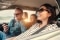 The picture shows a happy family in a car to represent the benefits of Comfort & Savings